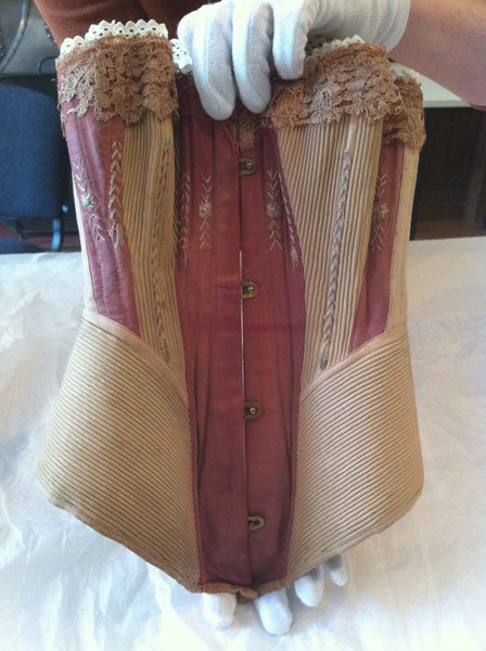 C1870-1879: MAROON AND MUSHROOM CORSET: CARROW HOUSE: COSTUME AND TEXTILE ARCHIVE (NORWICH, UK)