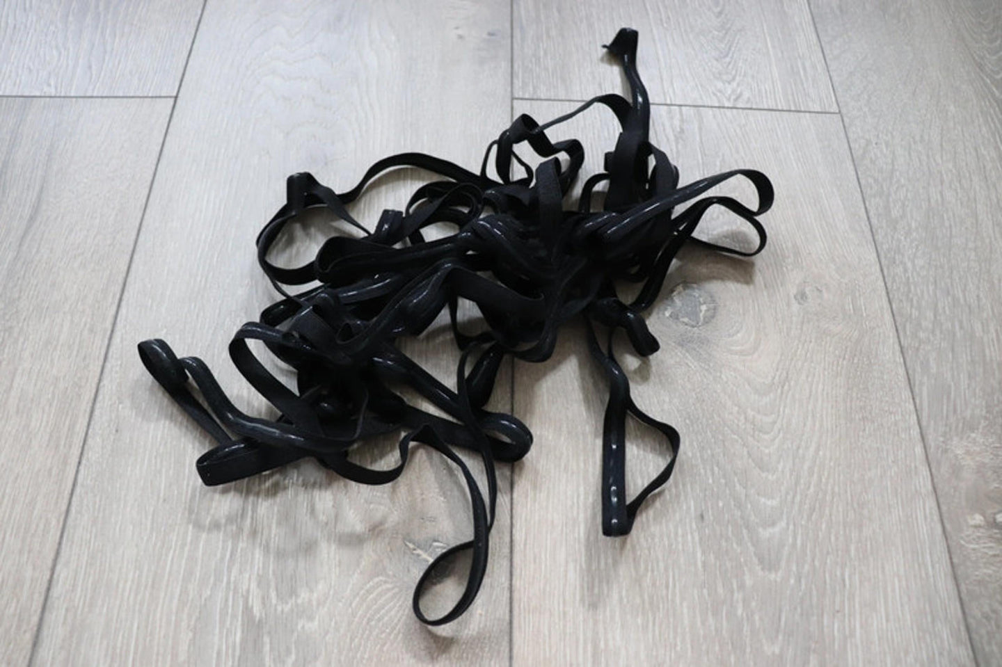 LOT#75 - bundle of black swimwear elastic with grip used on strapless cups.