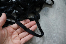 LOT#75 - bundle of black swimwear elastic with grip used on strapless cups.