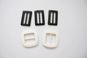 LOT #109 - 3 black and 2 white chunky adjusters, bag making accessory