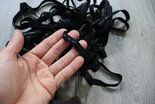 LOT#75 - bundle of black swimwear elastic with grip used on strapless cups.