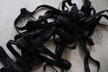 LOT#75 - bundle of black swimwear elastic with grip used on strapless cups.