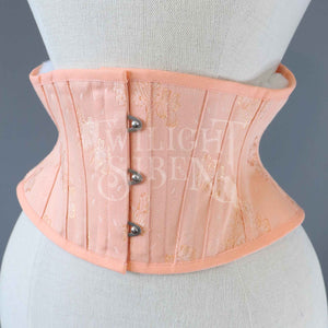 vintage salmon pink patterned coutil ELiza corset waspie. Short corset with silver busk fastening by Twilight Siren Corsetry