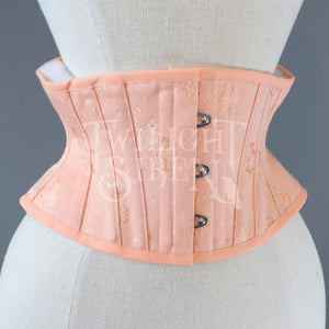 vintage salmon pink patterned coutil ELiza corset waspie. Short corset with silver busk fastening by Twilight Siren Corsetry