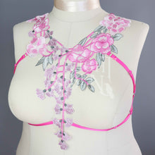 Plus size bright pink floral lace body harness with pink adjustable elastic straps with silver metal rings and sliders
